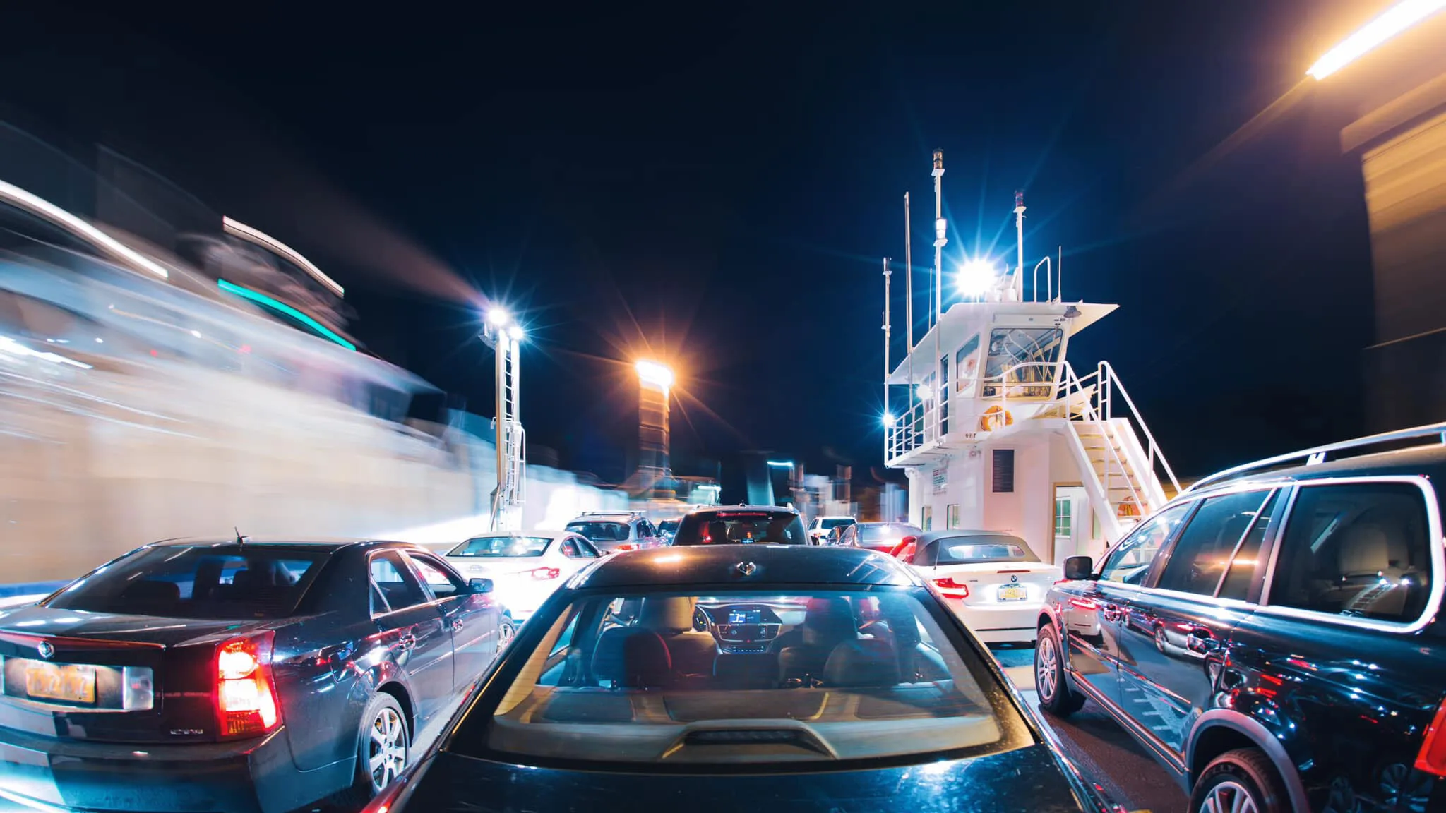 Cars aboard a ferry at night